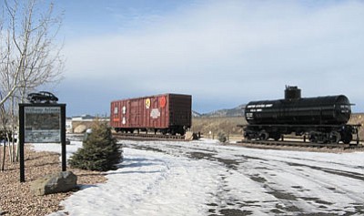 An Army tank car and box car sit on display in Glassburn Park at the east end of Williams. Photo/Al Richmond