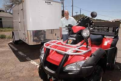 Michael DiMuria, a dispatcher and grant writer for Williams Police Department, shows off the department’s new ATV and trailer paid for with grant money. Ryan Williams/WGCN