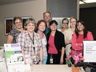 Williams North Country HealthCare Clinic employees Christine Porr, Jeff Axtell, Mary Case, Kathy Owens, Denise Rodriguez, Donna Johnson, Nora Dimuria and Terri Sherman prepare for the 22nd annual health fair and open house.  Ryan Williams/WGCN