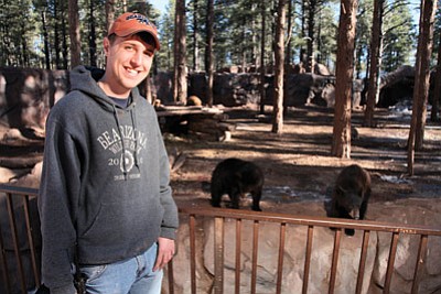 Bearizona’s Head Keeper Kyle Alexander checks in on some young bears at the park. Ryan Williams/WGCN