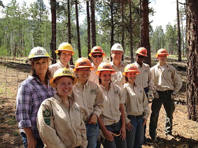 Youth Conservation Corp members take a work break last summer on the Williams District of the Kaibab National Forest. Front row from left: Amanda Tibai (mentor), Breanna Chester, Tyria Harvey, Chelsea Hardison. Back row from left: Susan Brown (grants management specialist), Alex Hreha (mentor), Joaquin Salas, Mike Williams (Forest Supervisor), Adam Fritsch and Carson Frahm. Submitted photo