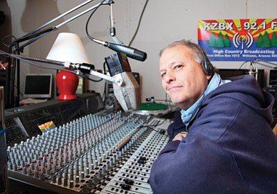 Leslie Stevens sits in the control room at KZBX 92.1 FM. Stevens recently launched the low power community radio station in Williams. Ryan Williams/WGCN