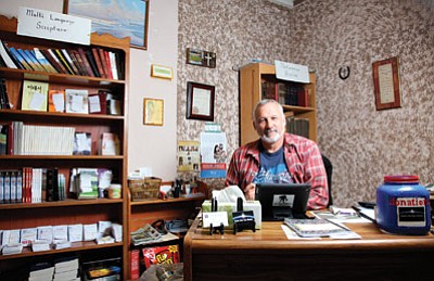Hope for the World founder Mike Rioux sits in his office on Route 66 in downtown Williams. Hope for the World provides clothing, food and spiritual support for those in need.  Ryan Williams/WGCN