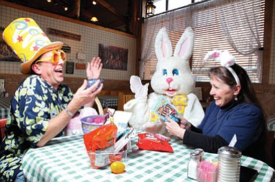 Williams Food Bank Director Guy Mikkelsen, the Easter Bunny, and Recreation Director Rose Newbold meet at Pine Country Restaurant to go over plans for this year’s Easter Eggstravaganza on April 4. Ryan Williams/WGCN