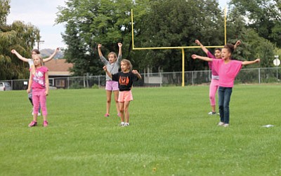 Bengals cheerleaders work on their routines at Williams High School.