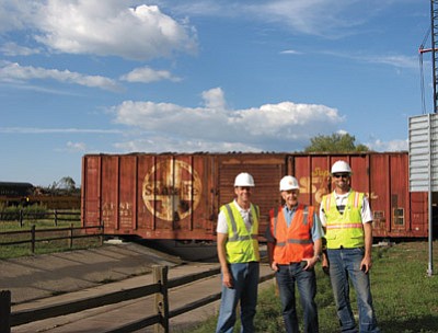 BNSF donated a train car to the Northern Arizona Railroad Museum. Museum founder Al Richmond orchestrated the donation and transfer with the city of Williams in what was a collaborative effort between the city and the museum. There will be rails inside with lights and fresh paint. Above: Williams City Manager Brandon Buchanan, Al Richmond and Williams Public Works Director Kyle Christiansen stand in front of the railcar.  Submitted photo