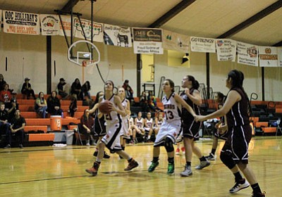 Dara Bowdon takes a shot under the basket against Arizona Charter. Wendy Howell/WGCN