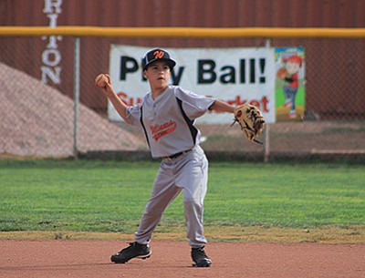 All-Star player Jesus Salazar throws the ball to first during the teams first game with Verde Valley June 20. The 11-12 boys team lost to Verde Valley 18-2. Wendy Howell/WGCN