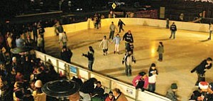 Skaters of all ages enjoy a free ride on the ice Dec. 9. Since opening last week, the ice rink has become a favorite attraction for both locals and visitors.