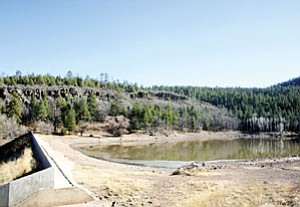 City Dam glistens in sunshine last week. No moisture this winter has may create a busy fire season for area firefighters. Homeowners are urged to remove forest debris and other fire hazards away from homes