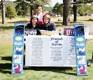 Last year¹s eighth hole ³Friends of Kevin² booth was manned by Monica Montanez, Trudy Heineman and Stephanie Konemenn, who distribute free gifts as golfers come by.