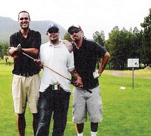 Three competitors take a short photo break during a recent Young Life golf tournament at Elephant Rocks Golf Course