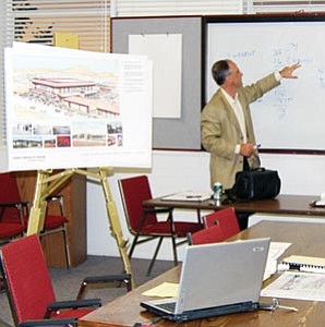Paul Fraser, President of Blaze Partners, LLC, goes over parking figures during the 3-D theater work session held Aug. 21 at Williams City Hall.