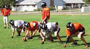 Viking football players practice often at Williams High School, including Labor Day Weekend. They play Friday at home against Mogollon, beginning at 7 p.m.
