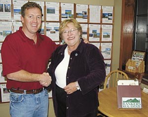 Bankers Real Estate broker/owner John Rushton and new Parks branch manager Carol Bultema.