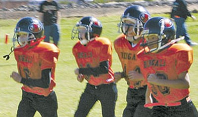 Young players run during the 2007 Bengals and Tigers youth football season.