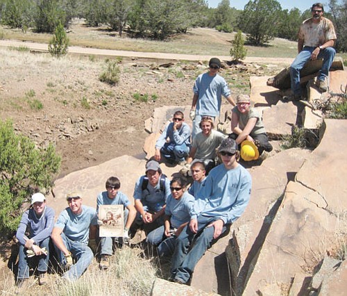 YCC crews take a break near an archaeological site outside of Ash Fork.