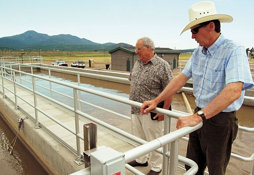<br>Patrick Whitehurst/WGCN<br>
Williams City Manager Dennis Wells (right) takes council member Bill Miller (left) on a tour of the city’s new wastewater treatment facility July 3.