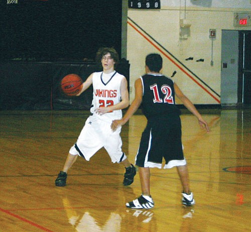 Patrick Whitehurst/WGCN
Viking Doug Forbis takes control of the ball. The Vikings took a 69-31 win over Seligman during the Jan. 24 Williams High School home game.