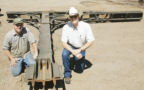 <br>Patrick Whitehurst/WGCN<br>
Pictured is city employee Sheldon Johnson and Williams City Manager Dennis Wells next to one of the historic railroad cantilevers that will be used as part of the Gateway structure to be located on Grand Canyon Boulevard near the McDonalds and Taco Bell/KFC.