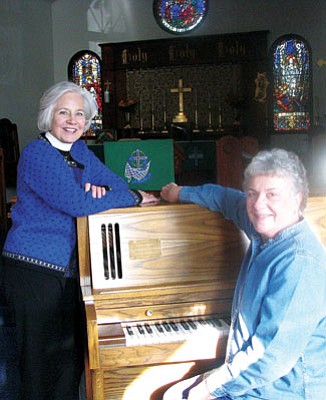<br>Lynda Duffy/WGCN<br>
The Rev. Ann Johnson (left) of St. John's Episcopal-Lutheran Church and parishioner Julia Glaab prepare for concerts that will be offered every Sunday during Advent. The first concert begins at 4 p.m. Sunday.