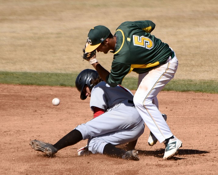 Yavapai’s Turtle Kuhaulua (5) loses the ball while Cochise’s Logan Bottrell slides into second base Tuesday afternoon at Roughrider Park in Prescott.  Cochise won the first game of the double header 7-0. 