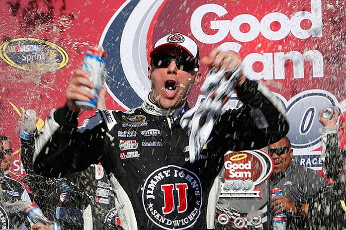 Kevin Harvick celebrates in victory lane after winning a NASCAR Sprint Cup Series auto race at Phoenix International Raceway, Sunday, March 13, in Avondale.