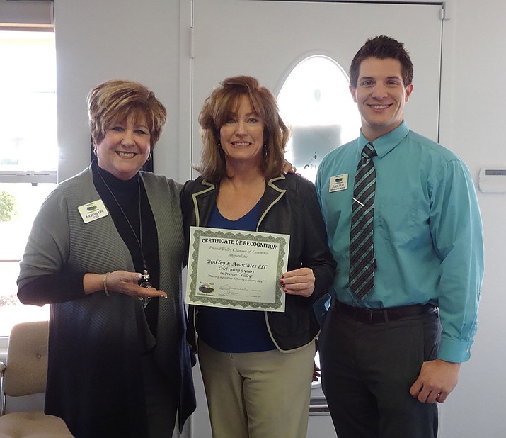 Chamber CEO/President Marnie Uhl and Membership Services Director  Zack Hurt presented Allstate Agent Robin Binkley with a certificate of appreciation.