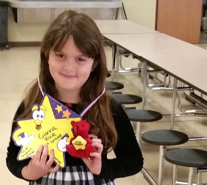 Gianna Rice, a first-grader at Granville Elementary School in the Humboldt Unified School District, shows her prize - a Star Student Bear - she won Monday, March 14, for participating in the district's National School Breakfast Week.