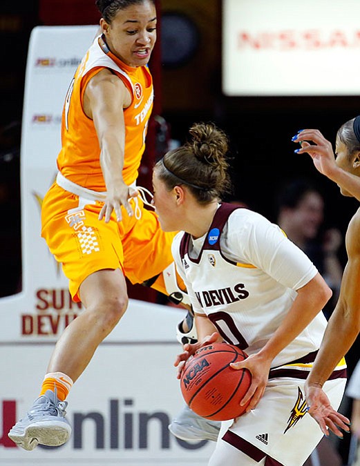 Tennessee guard Andraya Carter jumps trying to stop Arizona State guard Katie Hempen, during the first half of a second-round NCAA women’s college basketball game, Sunday, March 20, in Tempe. 