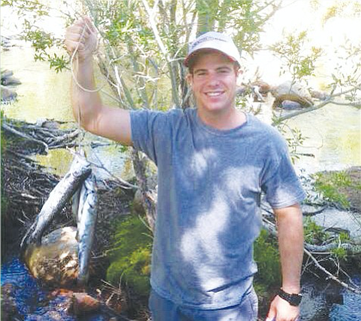 Joey Martin, who died in a California group home three years ago, lived his life “full throttle,” say his parents. Here, six months before his death, he joined his family on a fishing trip.

