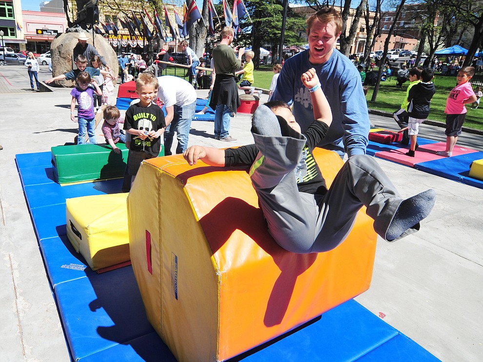 Eduardo Arguelles, six from Prescott Valley, enjoys the Flip City Gymnastics obstacle course during the Great Prescott Easter Egg Hunt Saturday morning on the Yavapai County Courthouse Plaza.(Les Stukenberg/The Daily Courier)