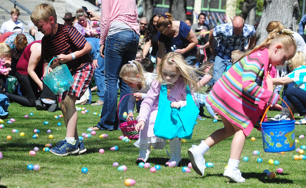 Kids grab their eggs during the Great Prescott Easter Egg Hunt Saturday morning on the Yavapai County Courthouse Plaza.(Les Stukenberg/The Daily Courier)