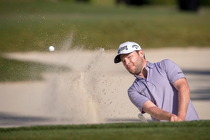 Branden Grace of South Africa hits out of the bunker on the 16th green during the final round of the RBC Heritage golf tournament in Hilton Head Island, S.C., Sunday, April 17. 