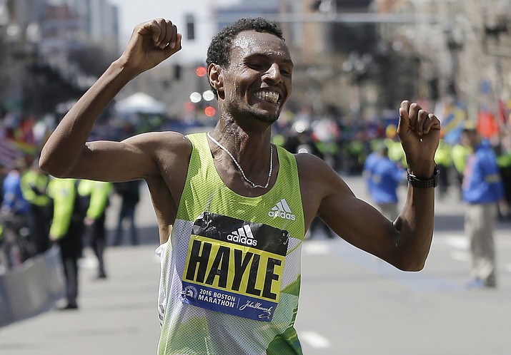 Lemi Berhanu Hayle celebrates after winning the 120th Boston Marathon on Monday, April 18, in Boston.