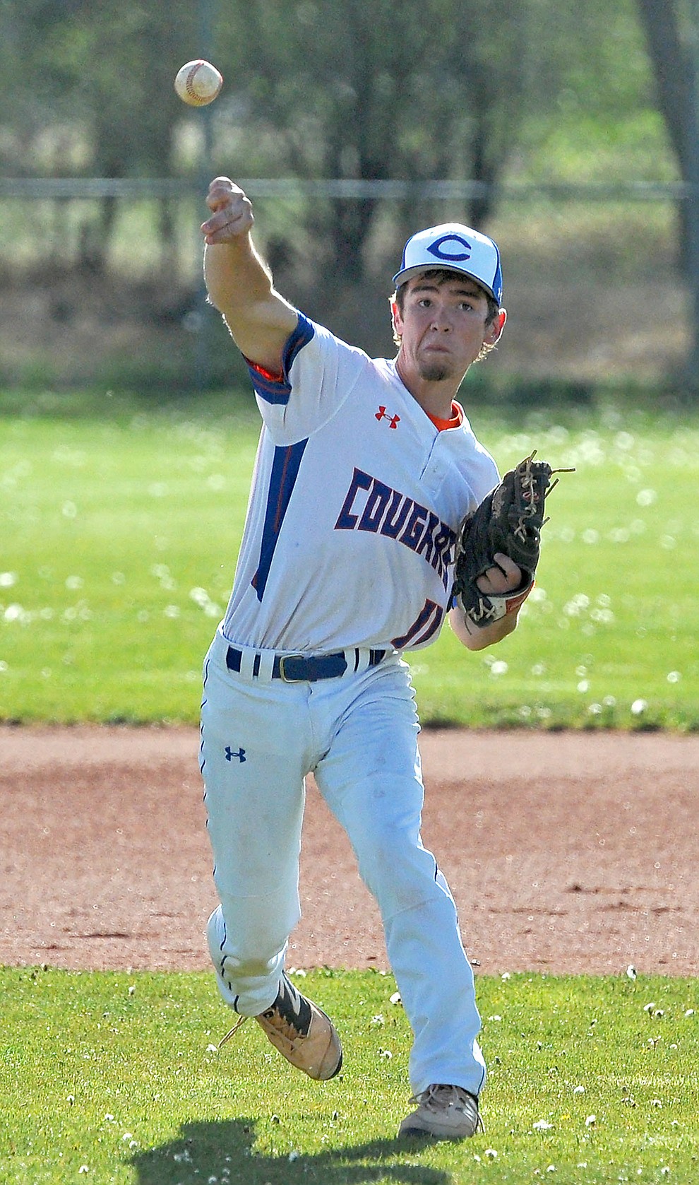 Chino Valley's John Gilbert (11) throws a ball towards first base for an out Tuesday afternoon April 19, 2016 while playing their last regular season home game against Mohave at Chino Valley High School. (Matt Hinshaw/The Daily Courier)