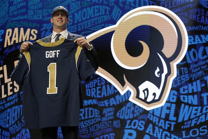 California’s Jared Goff poses for photos after being selected by the Los Angeles Rams as the first pick in the first round of the 2016 NFL football draft, Thursday, April 28, in Chicago. 