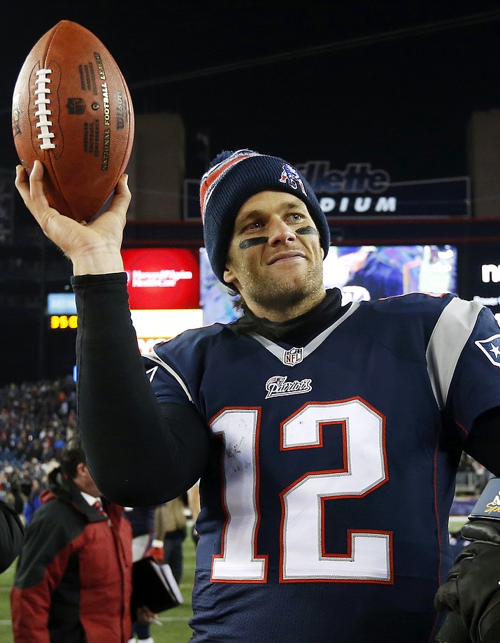 In this Jan. 10, 2015, file photo, New England Patriots quarterback Tom Brady holds up the game ball after an NFL divisional playoff football game against the Baltimore Ravens in Foxborough, Mass. A federal appeals court ruled, Monday, April 25, 2016,  that New England Patriots Tom Brady must serve a four-game "Deflategate" suspension imposed by the NFL, overturning a lower judge and siding with the league in a battle with the players union.