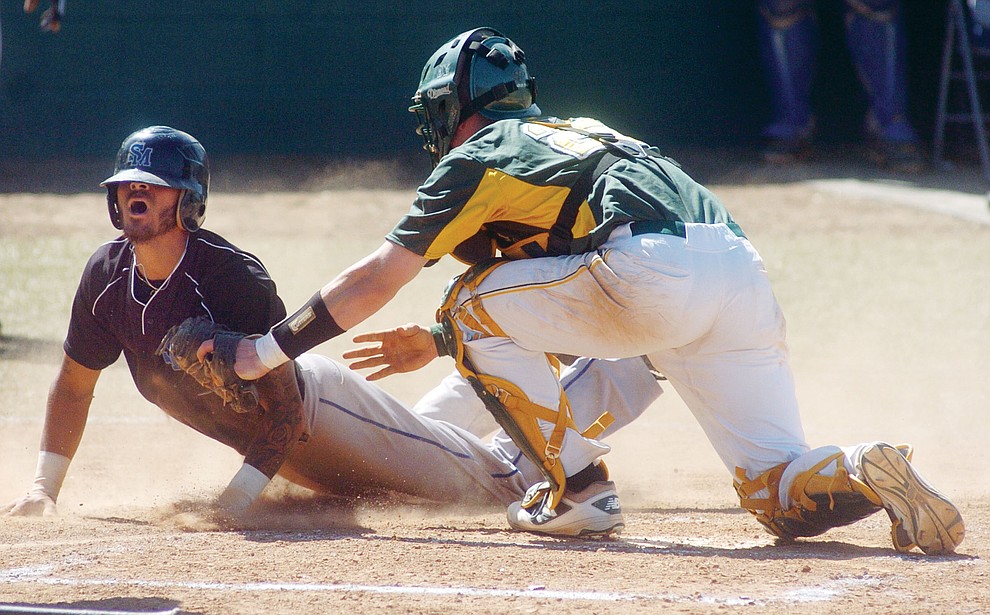 Yavapai's Gavin Johns tags out a South Mountain runner at home in the first game of the NJCAA Region 1 Division 1 semifinals Thursday in Prescott. (Les Stukenberg/The Daily Courier) (Les Stukenberg/The Daily Courier)