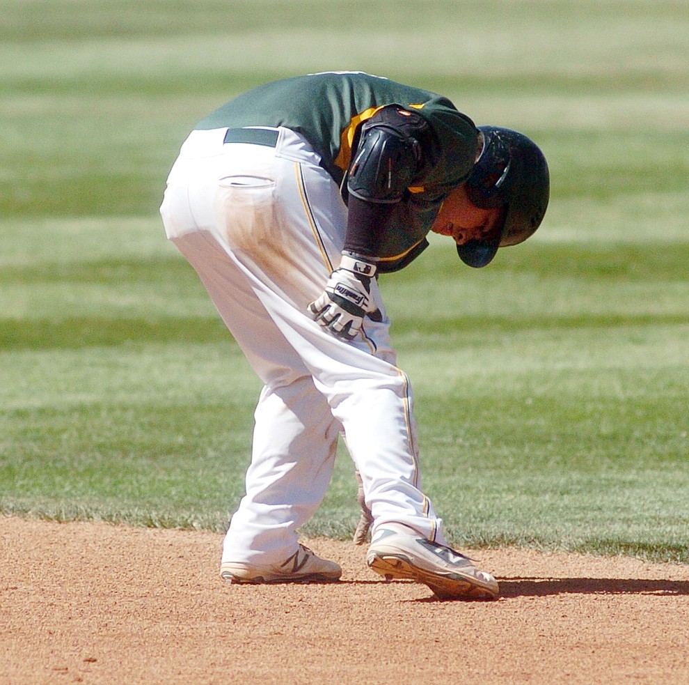 Yavapai's Jonathan Villa grabs his leg in pain after sliding into second base in the first game of the NJCAA Region 1 Division 1 semifinals Thursday in Prescott. (Les Stukenberg/The Daily Courier) (Les Stukenberg/The Daily Courier)