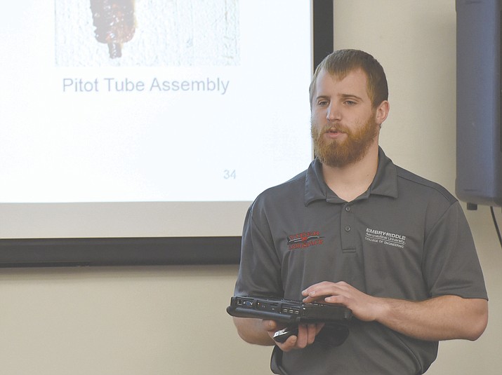 Embry-Riddle Aeronautical University mechanical engineering senior Shawn Berg gives his portion of his team’s senior capstone project presentation to members of the Engineering Industry Advisory Board.