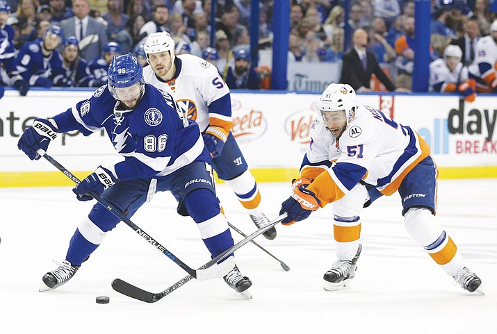 Tampa Bay Lightning’s Nikita Kucherov (86), of Russia, and New York Islanders center Frans Nielsen (51), of Denmark, fight for control of the puck during the second period of Game 5 of the NHL hockey Stanley Cup Eastern Conference semifinals Sunday, May 8, 2016, in Tampa, Fla. 