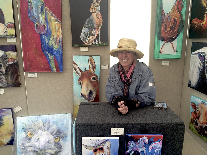 Brenda Peo with her artwork at the 30th Annual Mountain Artist Guild Art & Wine Festival.