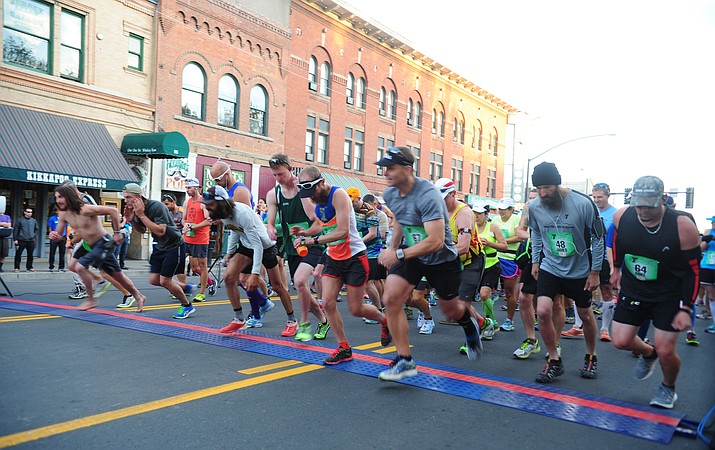 Runners start the marathon race during the 2015 Whiskey Row Marathon to benefit the Prescott YMCA scholarship fund.