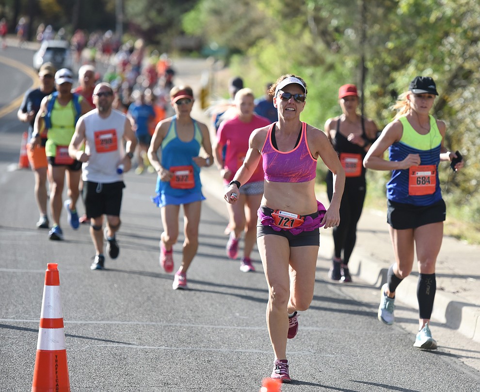 Runners in the half marathon head up Gurley Street in the 38th annual Whiskey Row Marathon Saturday morning in Prescott. (Les Stukenberg/The Daily Courier)
