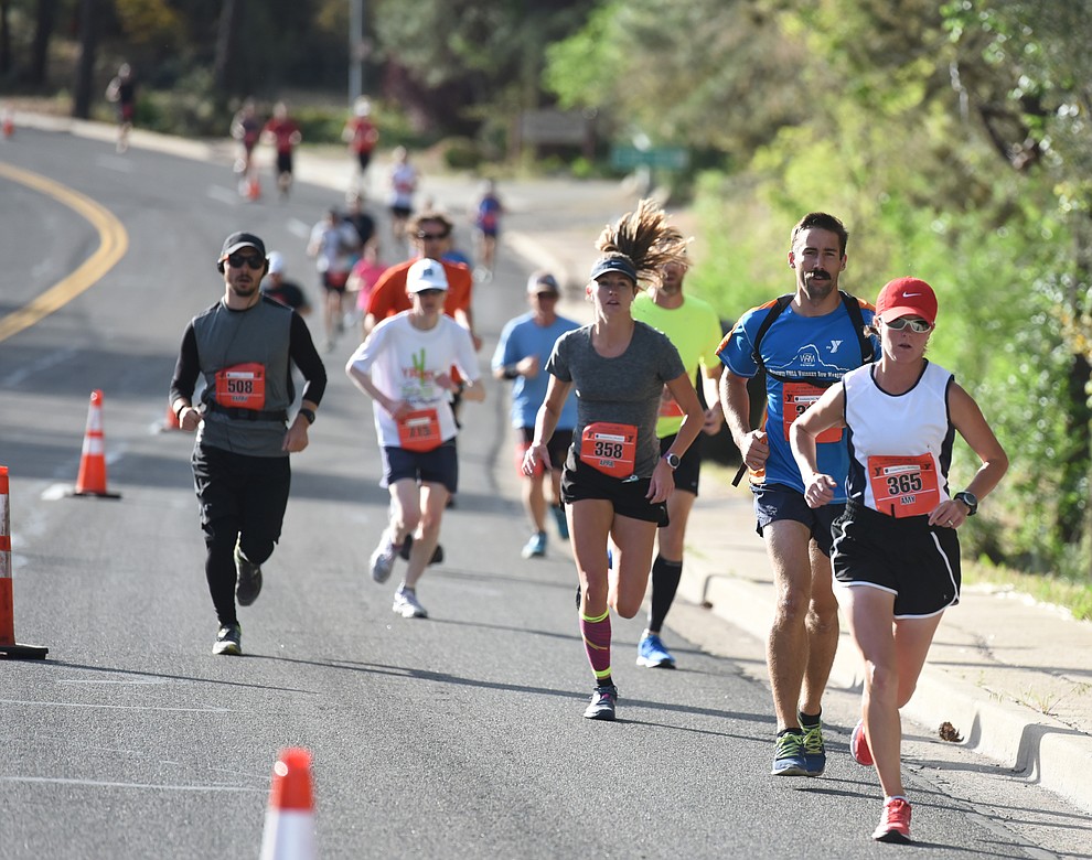 Half-marathon runners head up Gurley Street in the 38th annual Whiskey Row Marathon Saturday morning in Prescott. (Les Stukenberg/The Daily Courier)
