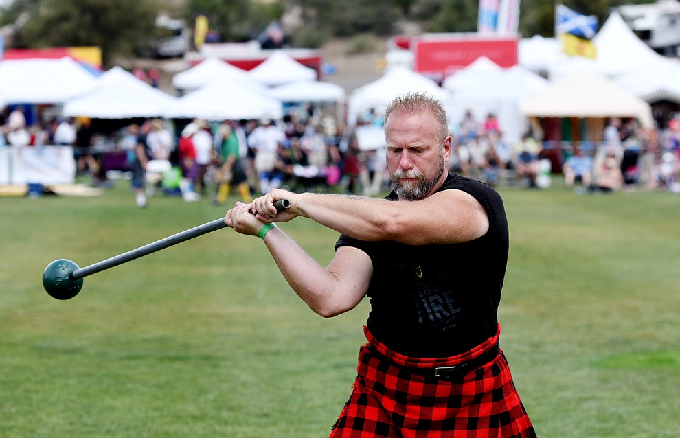 Bill Cabano warms up for the heavy hammer throw during the 2016 Highland Games Saturday morning in at Watson Lake Park in Prescott. (Les Stukenberg/The Daily Courier)