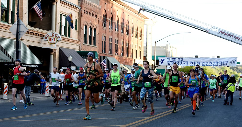 Runners begin the marathon in the 38th annual Whiskey Row Marathon Saturday morning in Prescott. (Les Stukenberg/The Daily Courier)