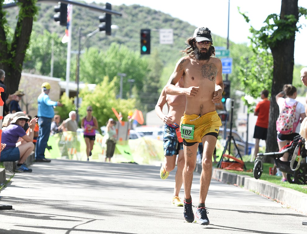 Local Michael Versteeg finishes the marathon in the 38th annual Whiskey Row Marathon Saturday morning in Prescott. (Les Stukenberg/The Daily Courier)