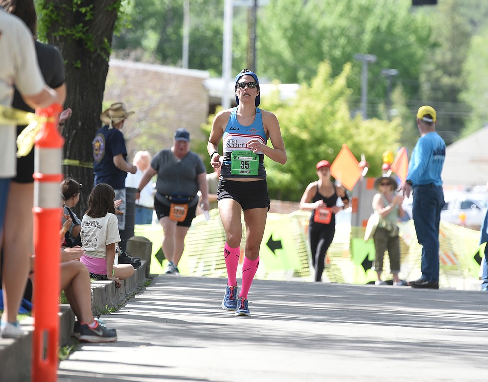 Monica Folts comes down the finish shoot to win the women's marathon in the 38th annual Whiskey Row Marathon Saturday morning in Prescott. (Les Stukenberg/The Daily Courier)